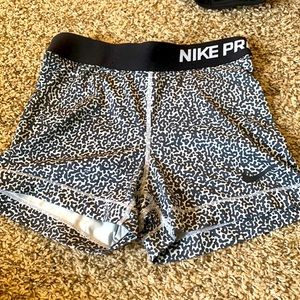 Nike pros, size small, white and black dots